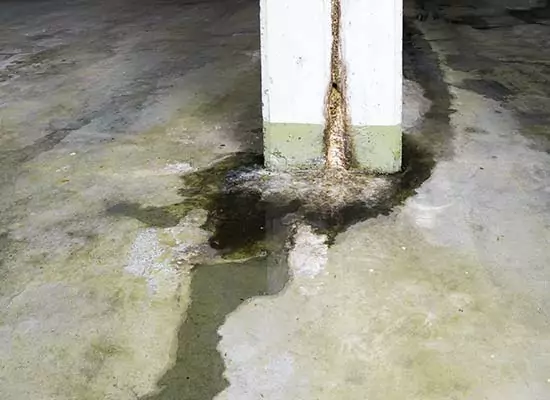 water-damage-in-concrete-construction-with-calcium-and-rust-depo