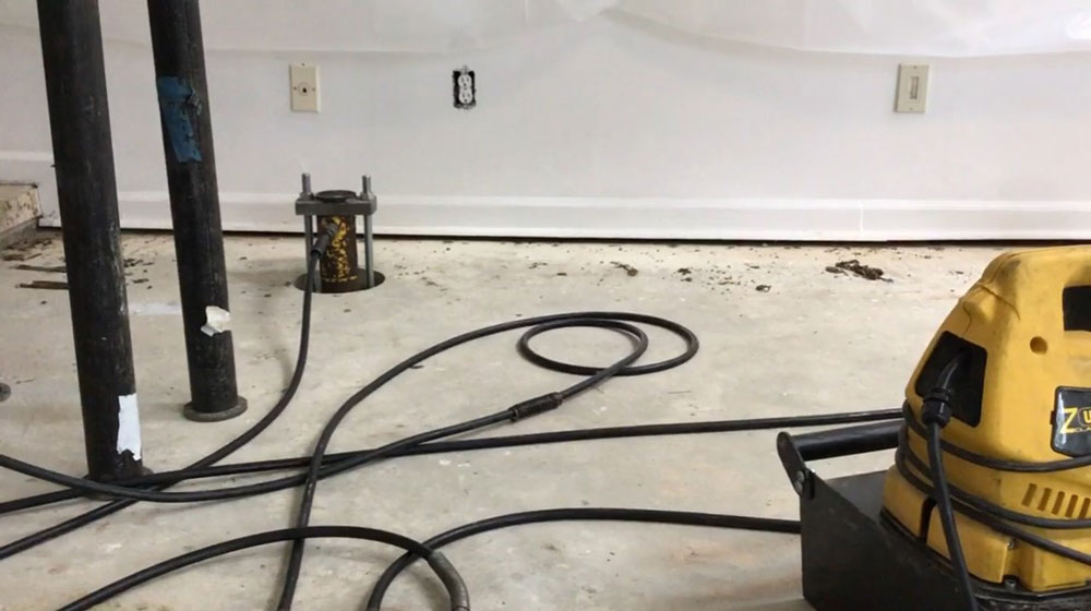 Slab push piers are a standard solution for stabilizing and lifting a settled slab foundation.