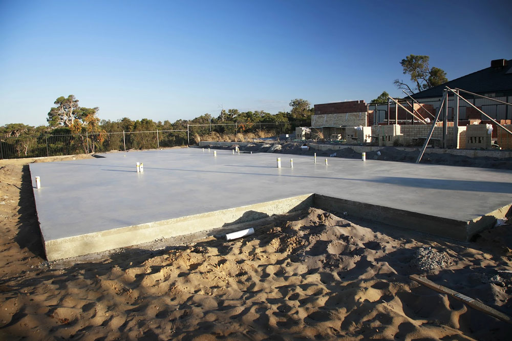A slab home is a residential building constructed with a concrete slab as its foundation. Unlike traditional foundations that incorporate crawl spaces or basements, slab homes are built directly on a solid concrete base.