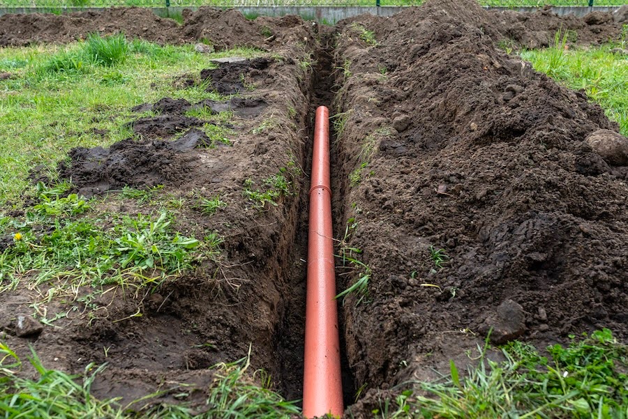 Image of a drainage pipe deep in the ground.
