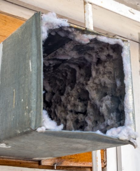 Old air duct filled with dust and dirt